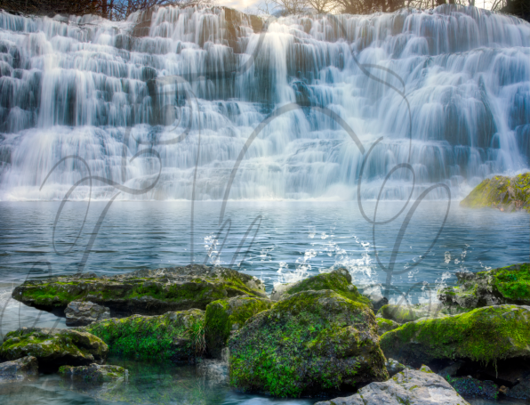 Majestic Falls Splashing on Mossy Rocks